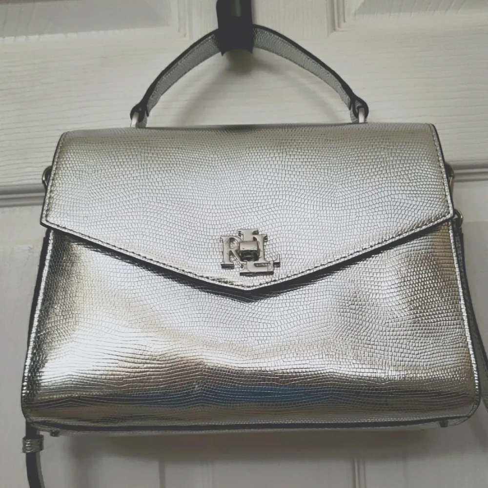 Lauren Ralph LaurenSilver Satchel with Structured Shape and Flap Closure.‎ (B1)